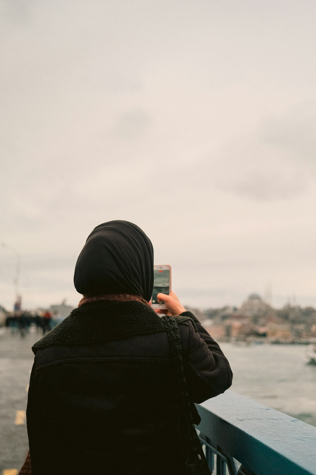 Turkish woman reading news on a smartphone